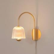 Nuura LED-væglampe Asteea, bredde 16 cm, messingfarvet/klar